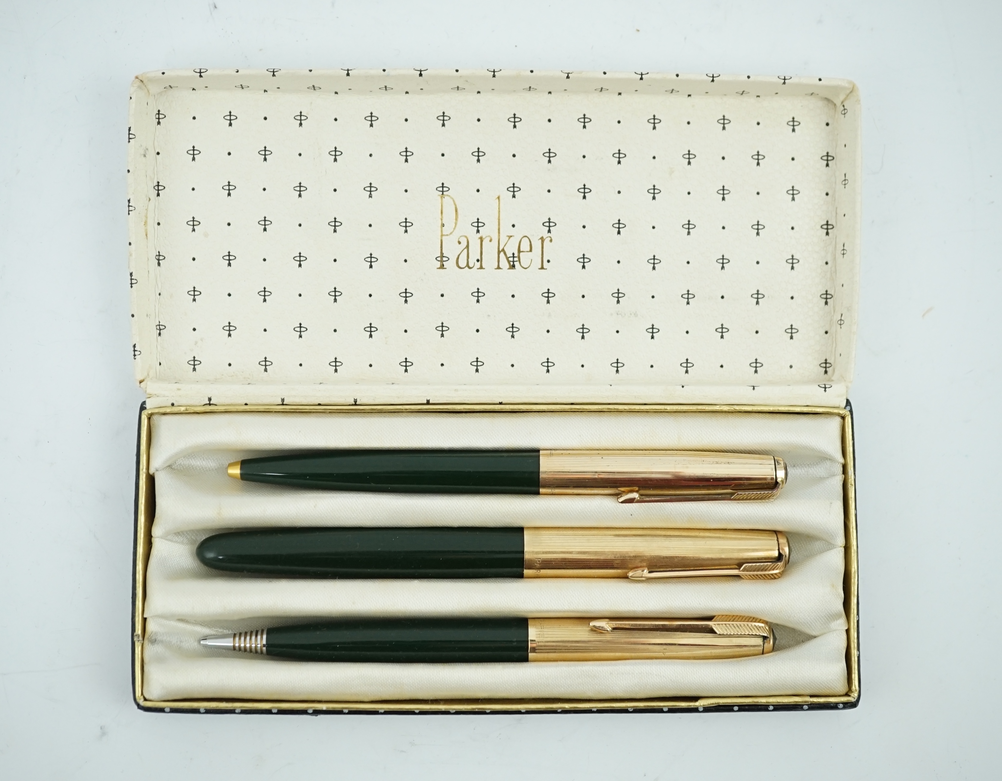 A Parker '51' Aerometric fountain pen, ball pen and pencil set in rare 'Forest Green'